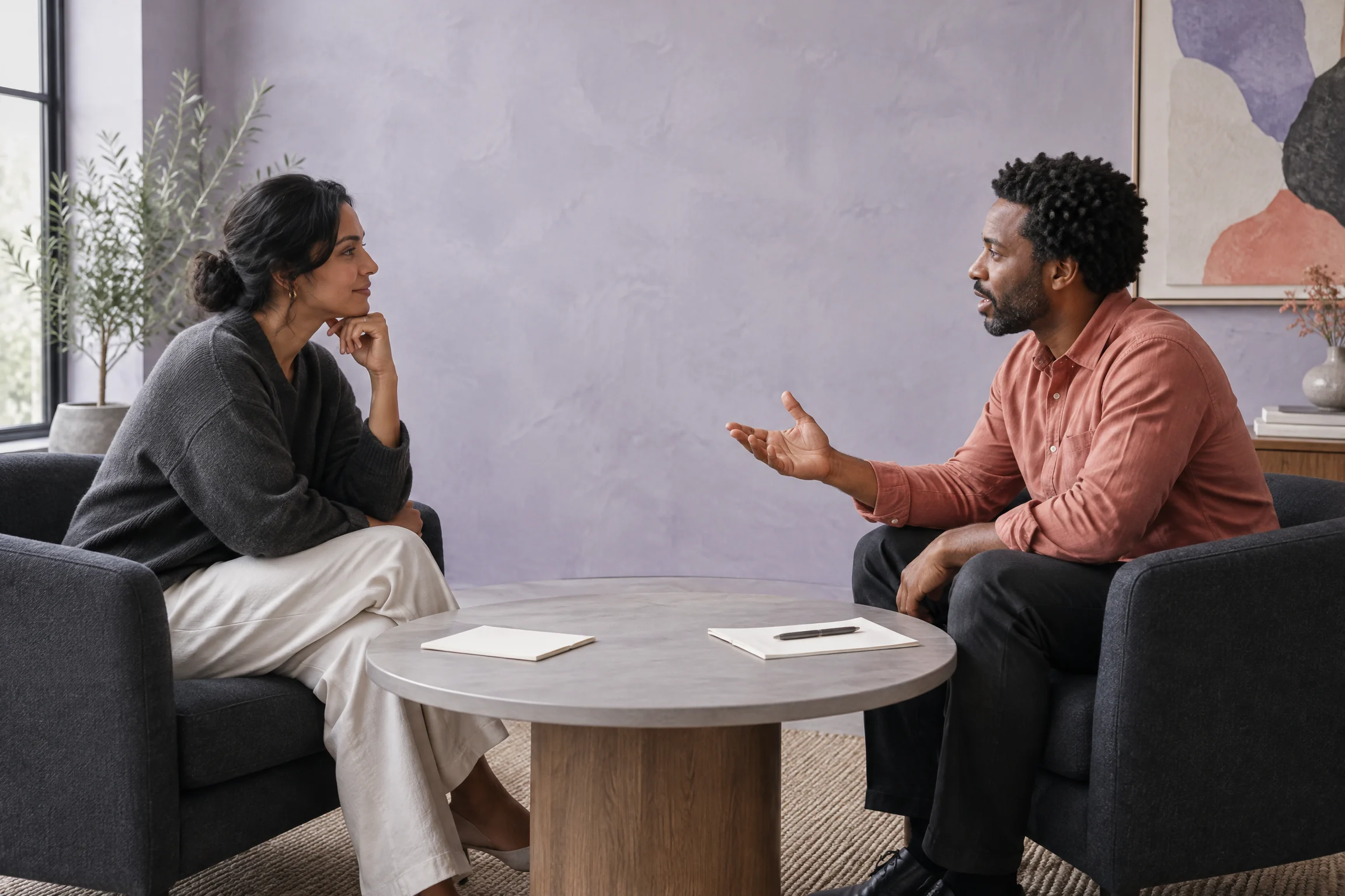 Two professionals in an attentive conversation