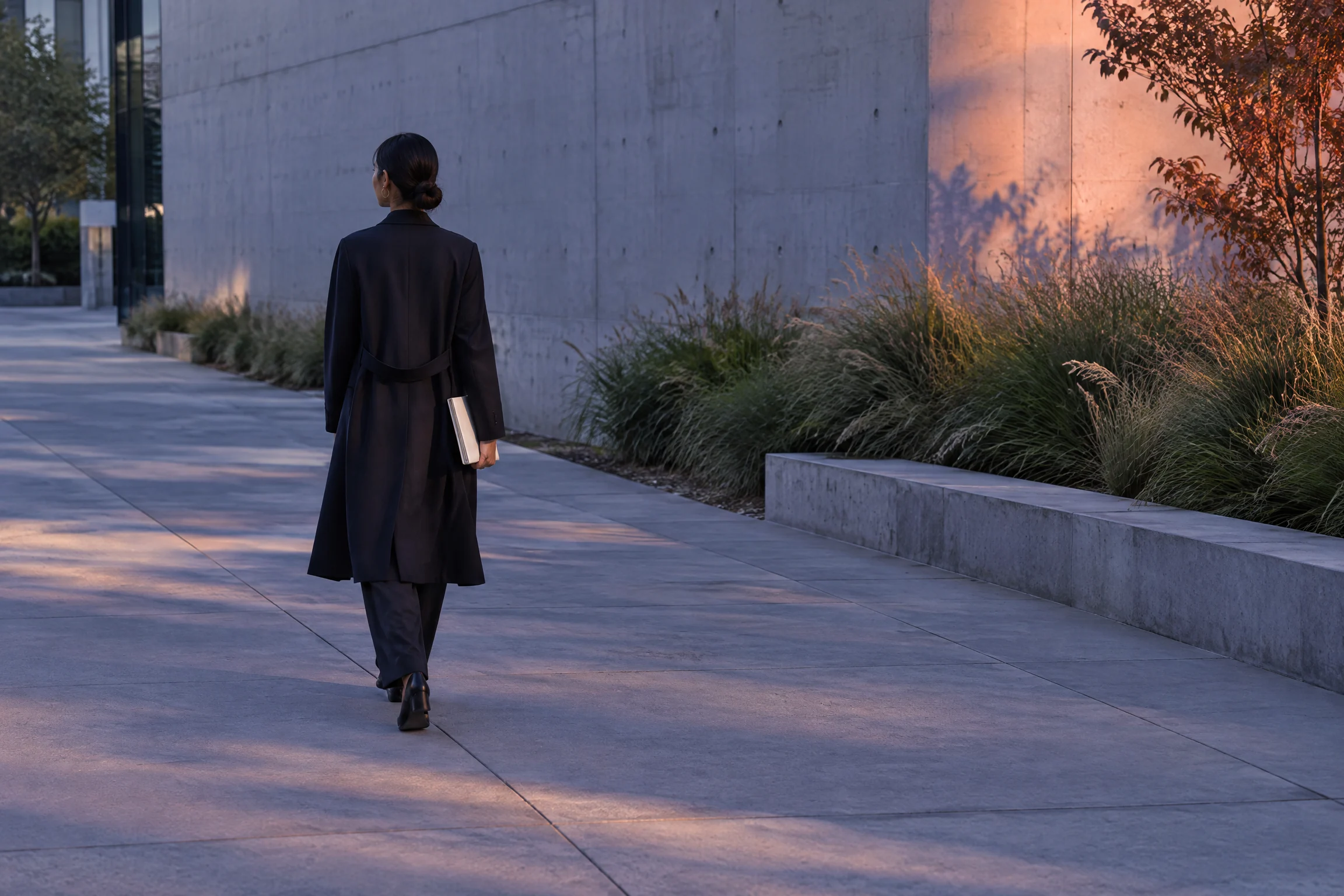 Professional walking through the city while reflecting